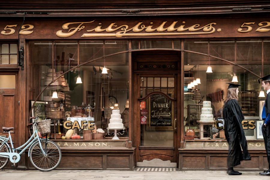 The Fitzbillies shopfront with its gold lettering and a bicycle outside, Cambridge